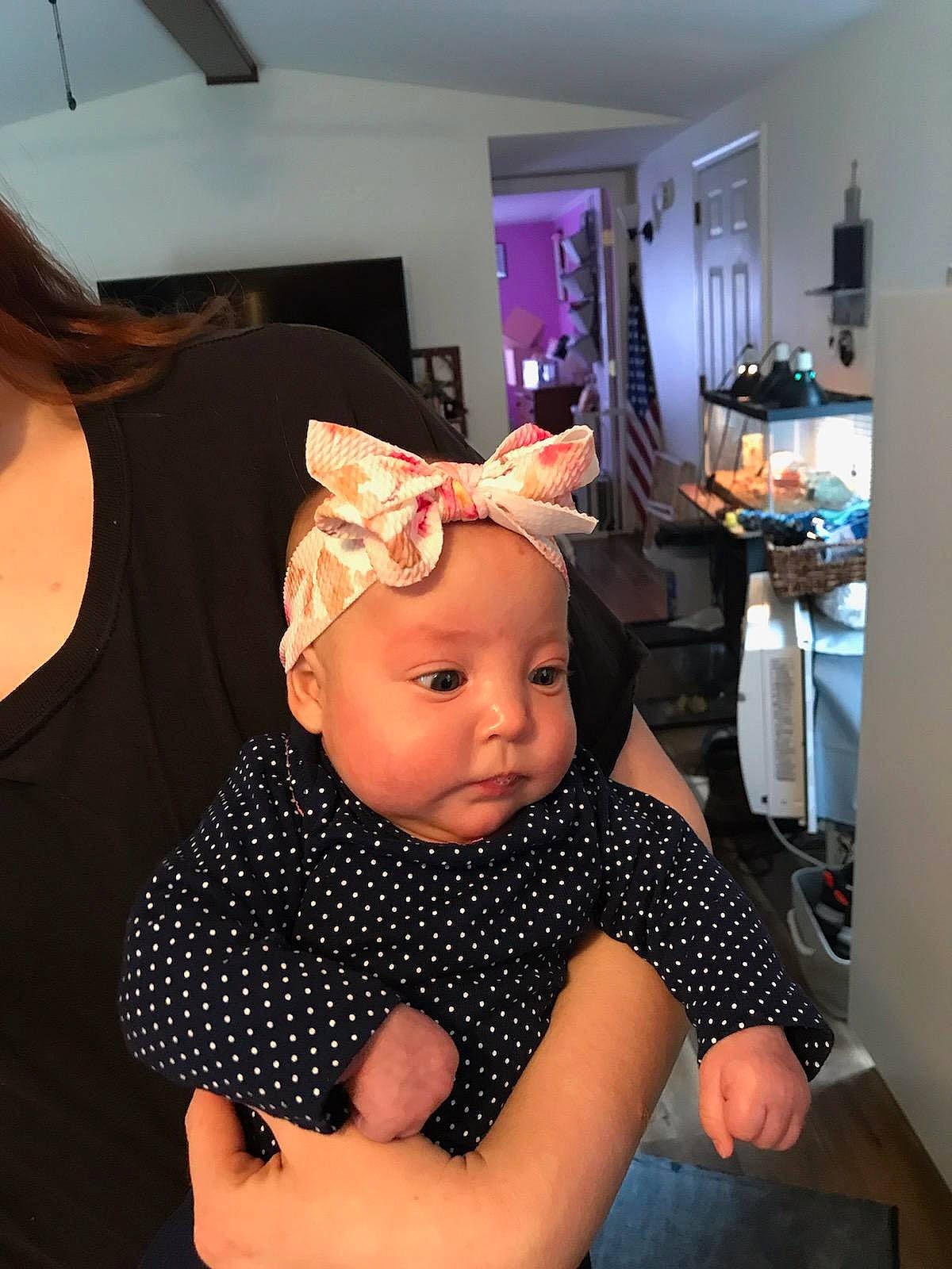 Maliah is registered to the contest to win money with this photo: baby, baby_toddler_clothing, child, costume_hat, fashion_accessory, flooring, fun, hair_accessory, hat, headband, headpiece, headwear, party_supply, pattern, person, polka_dot, purple, room, sitting, sleeve