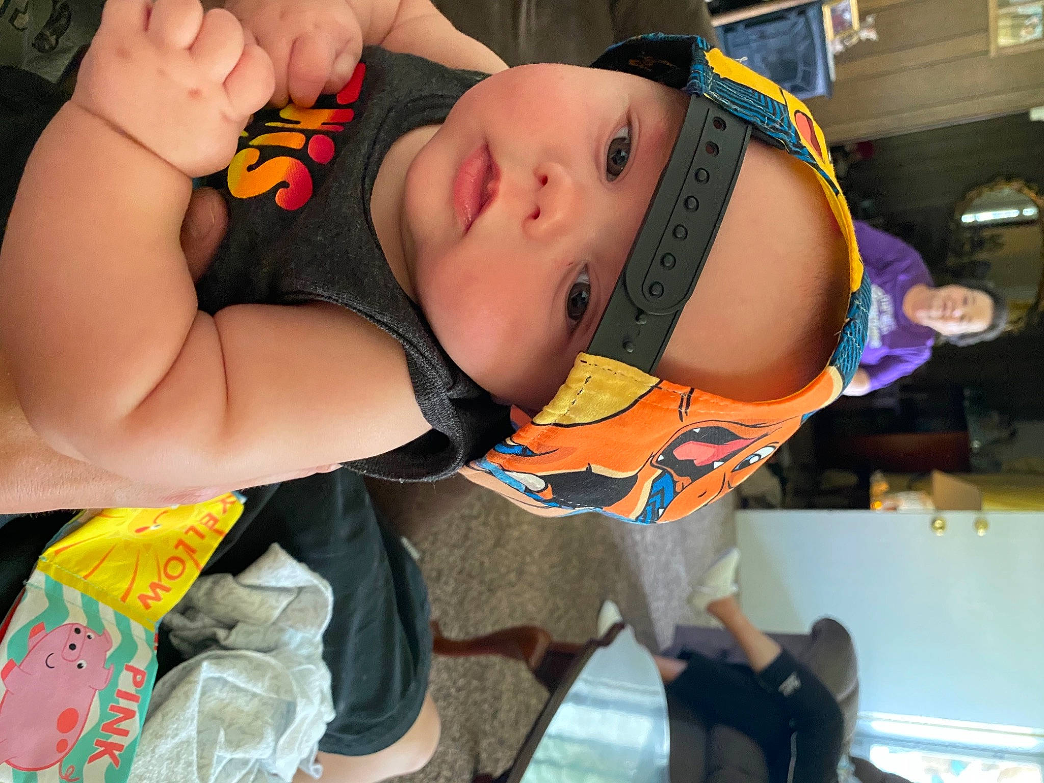 Ozzy is registered to the contest to win money with this photo: abdomen, arm, black_hair, chest, elbow, event, eyewear, flesh, fun, headwear, human_leg, joint, leg, mouth, muscle, navel, orange, person, thigh, trunk