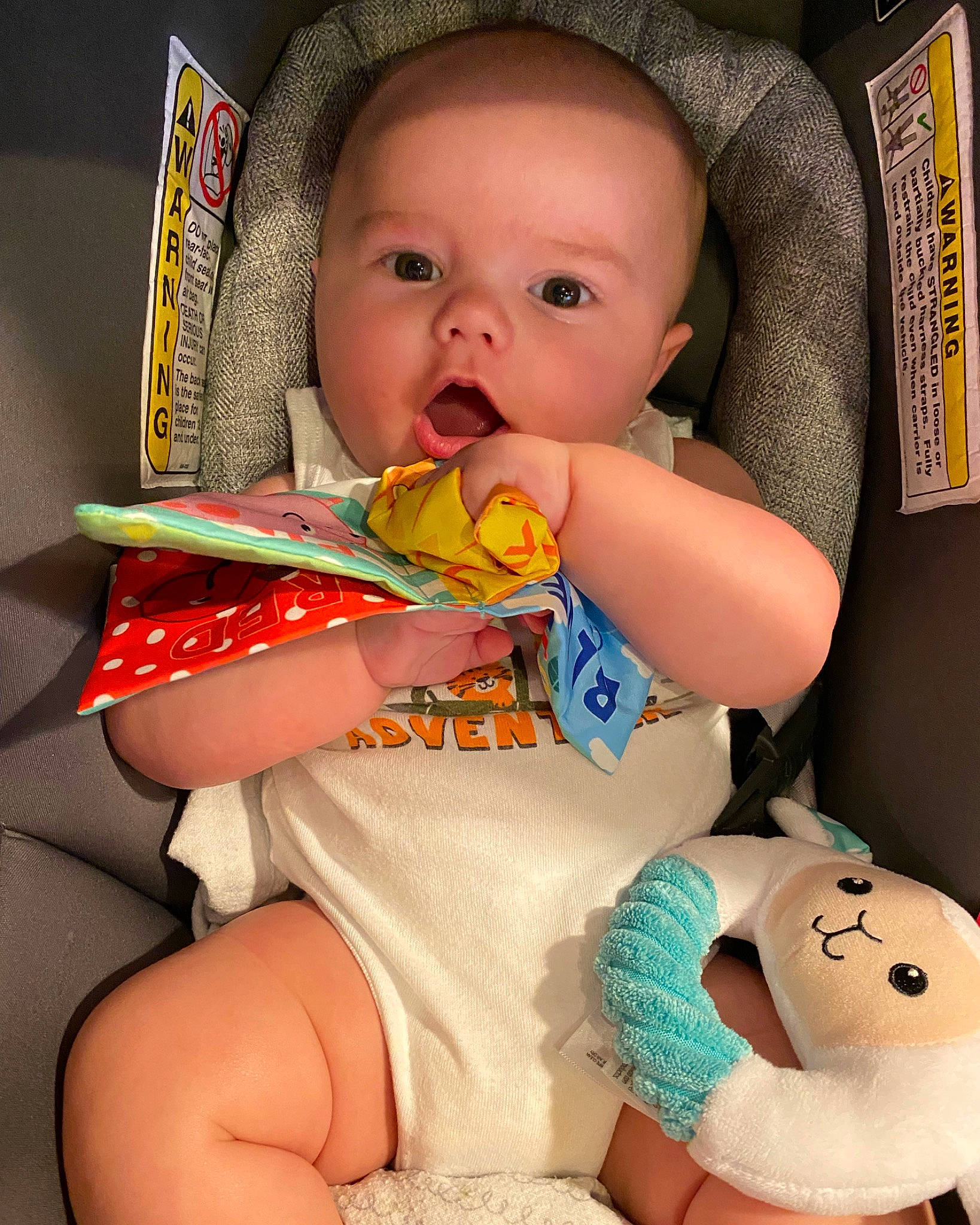 Ozzy is registered to the contest to win money with this photo: baby, baby_products, baby_toddler_clothing, cheek, child, comfort, eye, finger, happy, human_leg, linens, mouth, nail, pattern, person, room, sitting, skin, textile, thigh