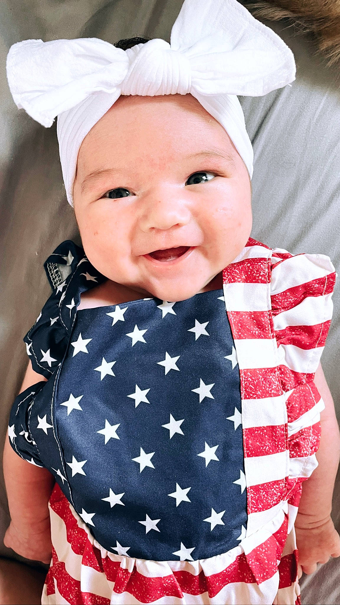 Kamilla is registered to the contest to win money with this photo: baby, baby_toddler_clothing, child, costume_hat, electric_blue, eye, face, fashion_accessory, flag_of_the_united_states, happy, hat, head, headwear, lip, pattern, person, pink, skin, sleeve, smile