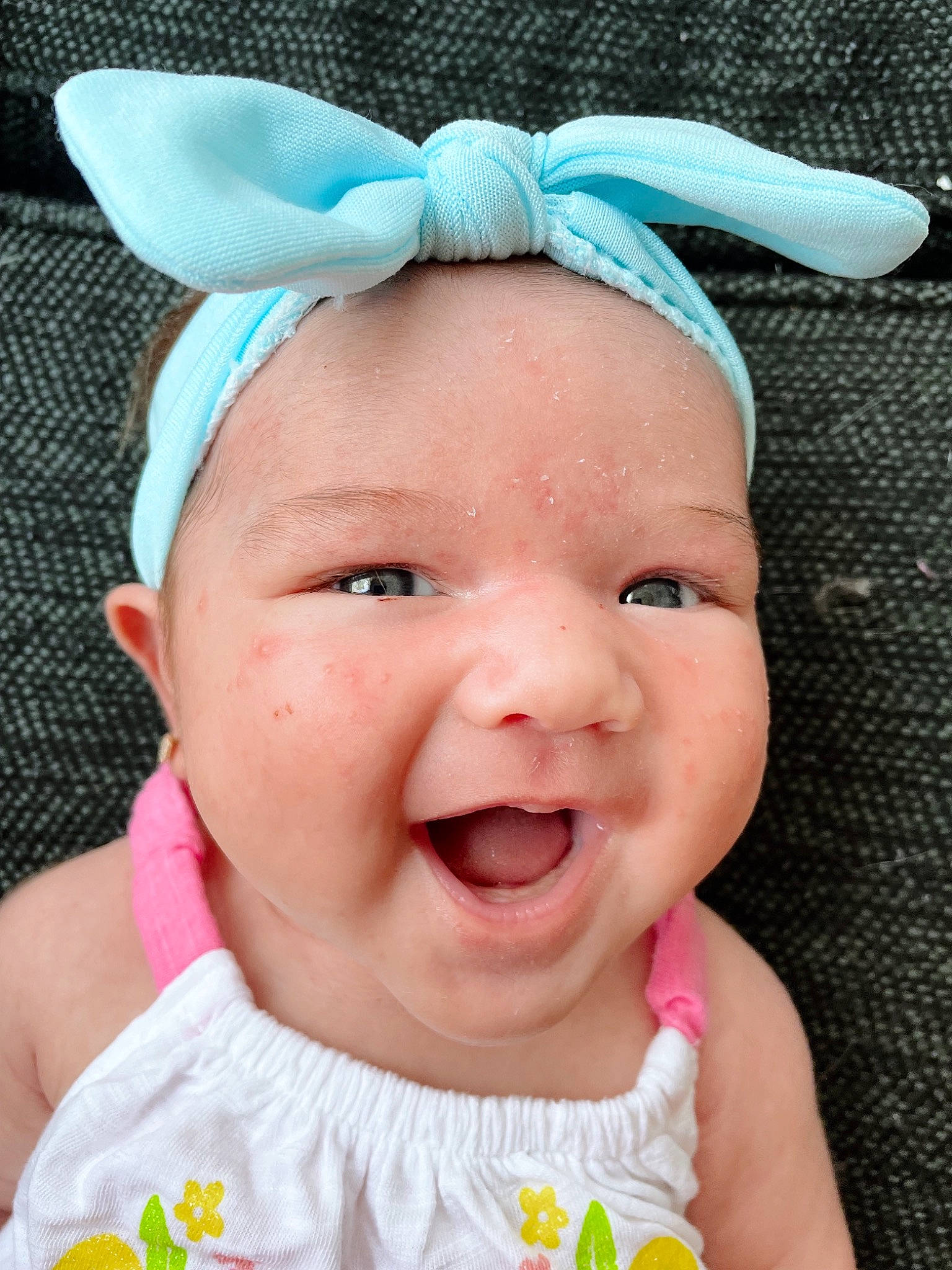 Kamilla is registered to the contest to win money with this photo: baby, baby_toddler_clothing, blue, cheek, eyelash, facial_expression, grass, green, happy, head, headband, headpiece, headwear, lip, nose, person, photograph, pink, skin, smile