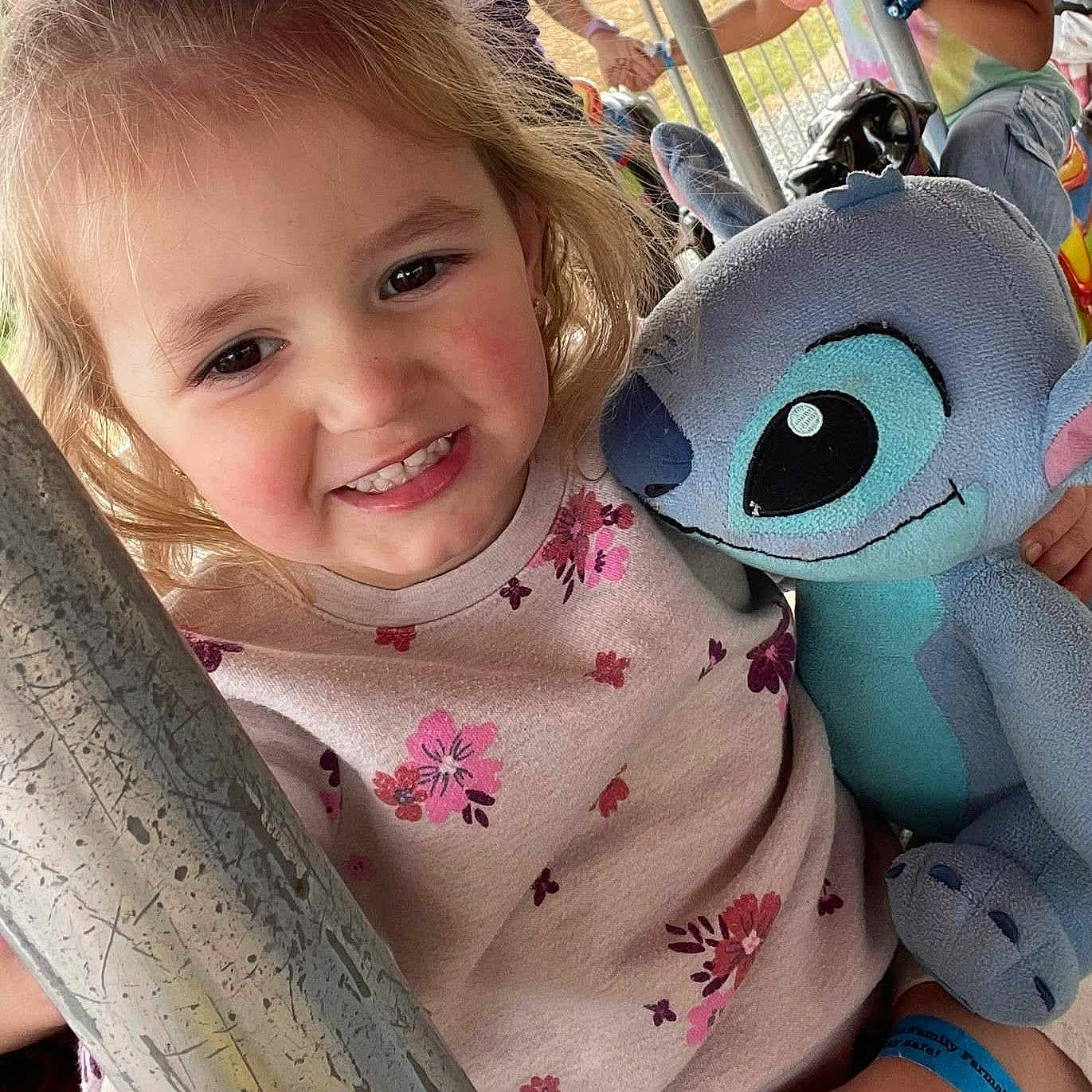 Haydon joined the competition — help win amazing prizes! amusement_ride, bracelet, carousel, child, clothing, cute, face, flower_pattern, fun, girl, hand, happy, outdoor, person, playground, plush_toy, smile, stuffed_animal, toy, young_child