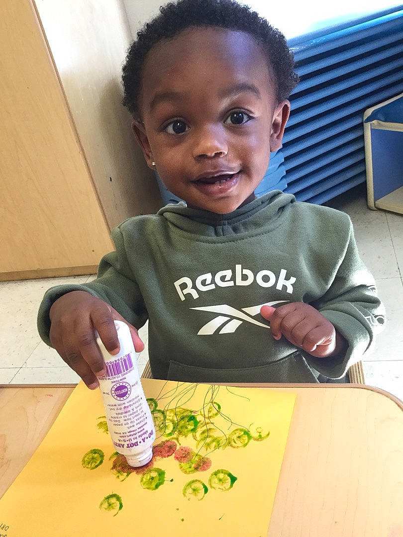 Pierre joined the competition — help win amazing prizes! chair, child, computer_monitor, drink, drinkware, eye, face, finger, fun, hand, happy, head, nail, paint, person, plastic_bottle, smile, t_shirt, table, television