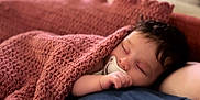 Anastasia participe au concours pour gagner de l'argent avec cette photo : baby, blanket, pacifier, sleeping, child, cozy, soft, curly_hair, resting, indoor, comfort, peaceful, portrait, closeup, infant, cuddled, warm, nap, hand, relaxation
