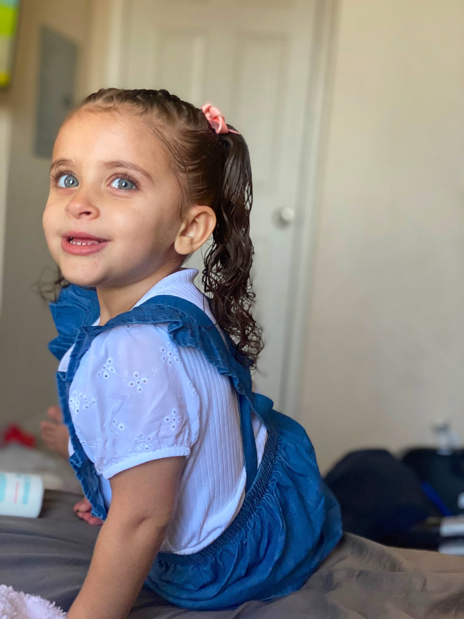 Jaslyn is registered to the contest to win money with this photo: abdomen, baby_toddler_clothing, brown_hair, child, elbow, electric_blue, fashion_design, flash_photography, formal_wear, fun, happy, person, room, sitting, sleeve, smile, sportswear, t_shirt, thigh, toddler