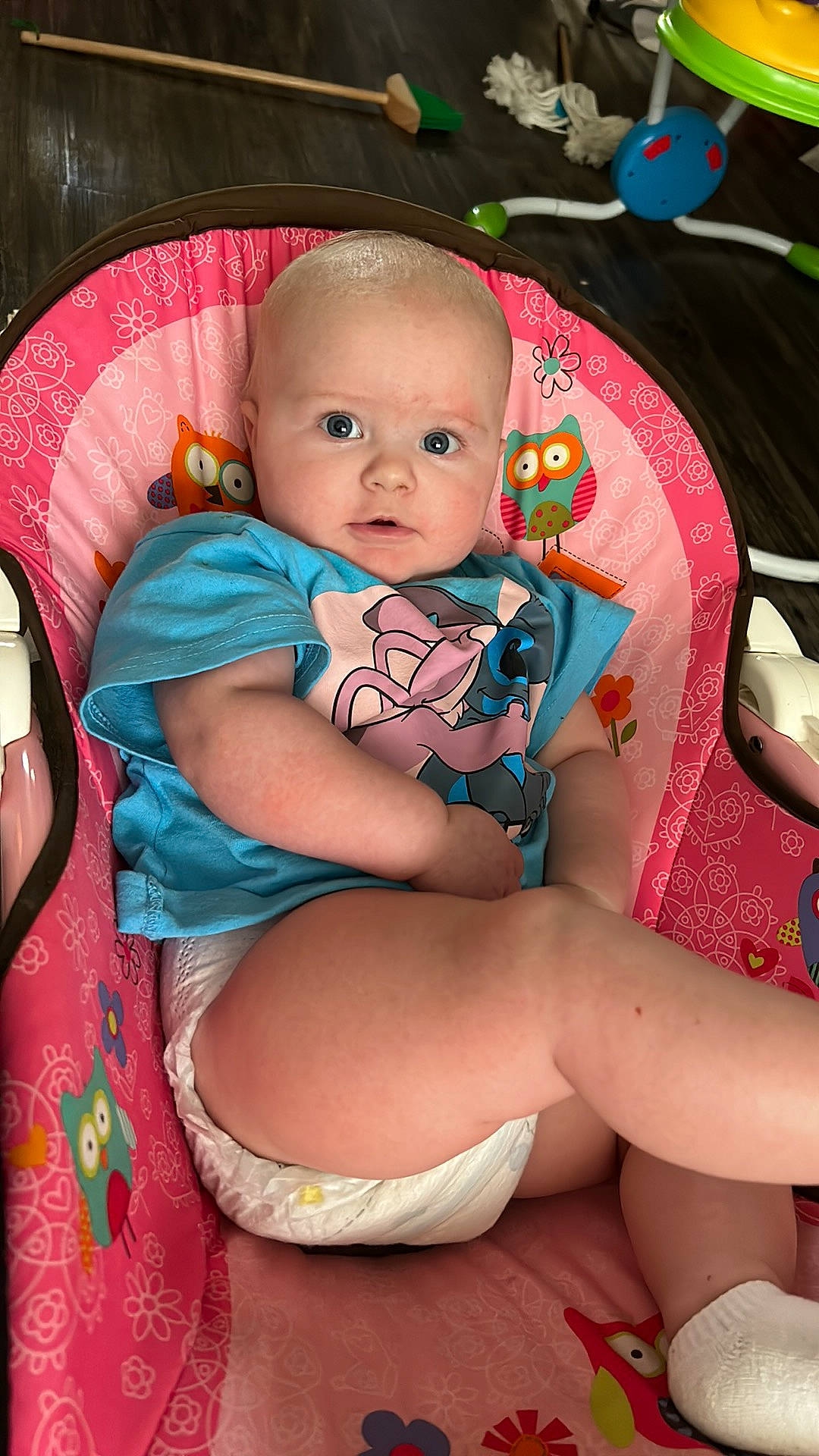 Zelena is registered to the contest to win money with this photo: baby, baby_products, baby_toddler_clothing, cheek, child, comfort, eye, finger, happy, human_leg, iris, knee, lap, mouth, pattern, person, pink, sitting, skin, thigh