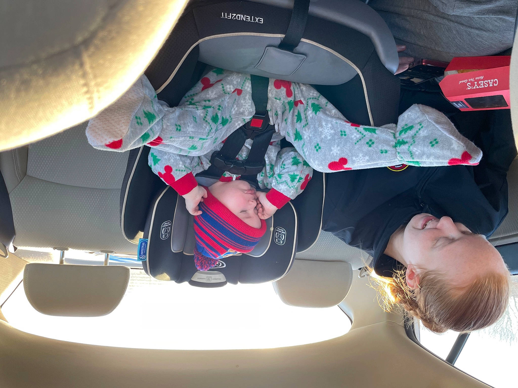 Paxton is registered to the contest to win money with this photo: auto_part, automotive_design, automotive_exterior, automotive_lighting, bumper, car_seat, carmine, fedora, fun, hat, headwear, helmet, human_leg, joy, luxury_vehicle, motor_vehicle, person, sports_gear, steering_wheel, t_shirt