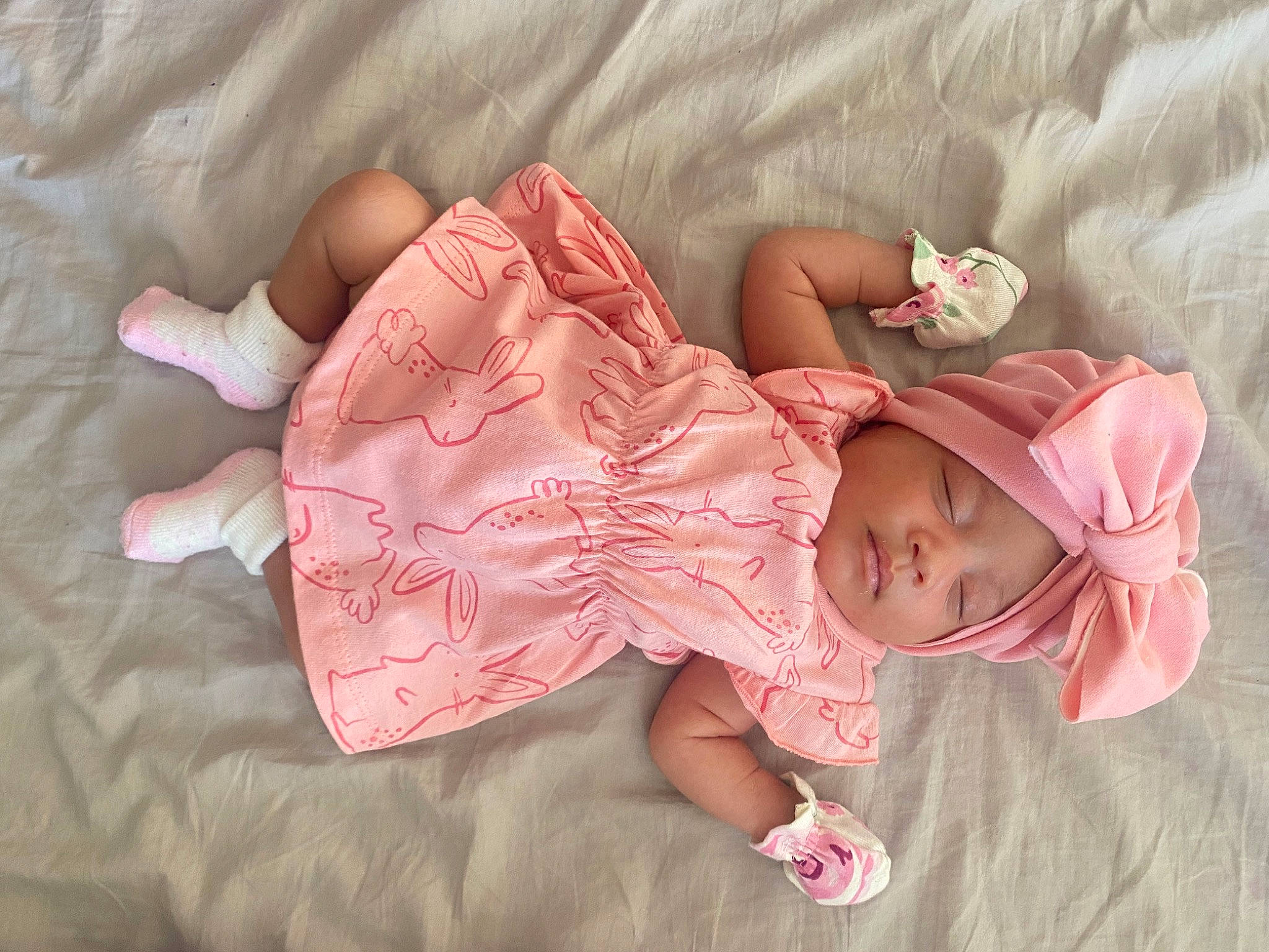 Nia is registered to the contest to win money with this photo: baby, baby_products, baby_toddler_clothing, cheek, child, clothing, comfort, dress, glasses, hand, hat, headgear, headwear, linens, lip, pattern, person, pink, skin, sleeve