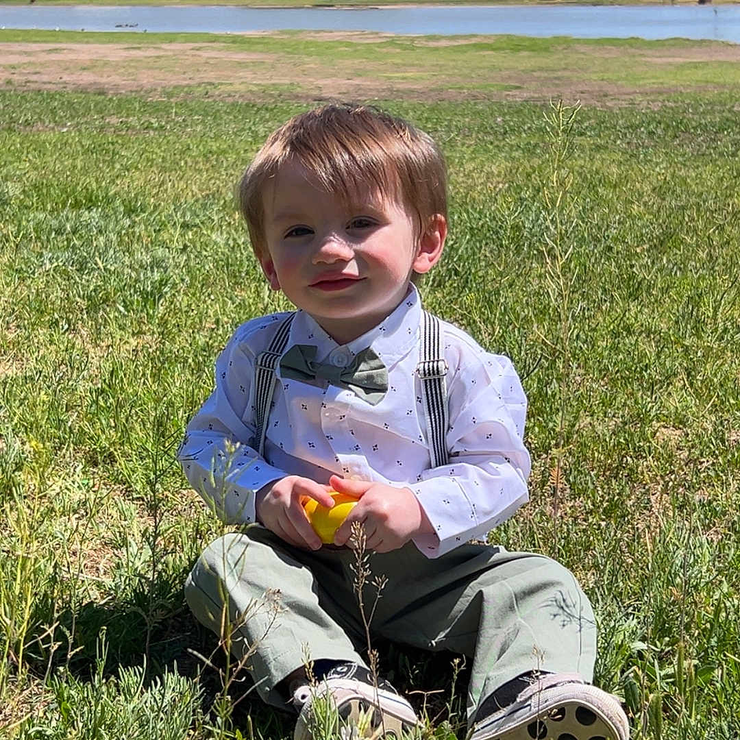 Robert joined the competition — help win amazing prizes! boy, child, clothing, face, field, footwear, grass, grassland, head, lawn, male, nature, outdoors, pants, person, photography, plant, portrait, shoe, sitting