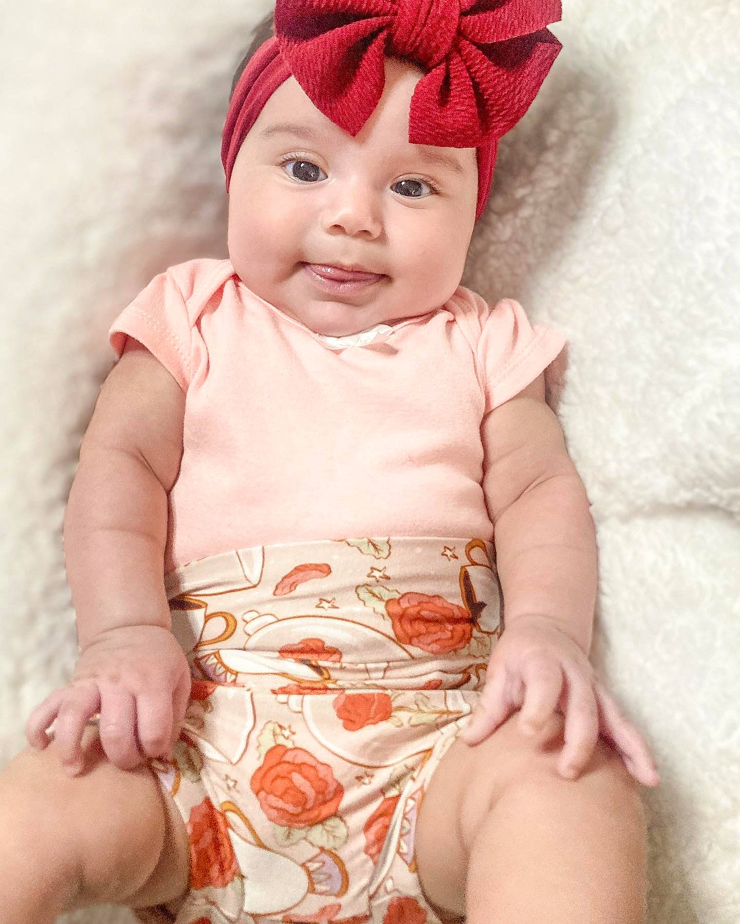 Ari joined the competition — help win amazing prizes! baby, baby_toddler_clothing, cap, cheek, dress, eye, face, facial_expression, happy, head, headgear, headwear, lip, neck, nose, person, pink, skin, sleeve, smile