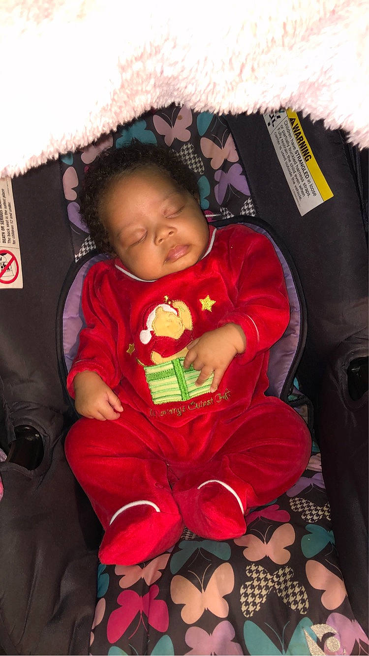 Desire is registered to the contest to win money with this photo: baby, baby_toddler_clothing, carmine, child, comfort, cool, happy, holiday, lap, linens, magenta, person, pink, product, room, sitting, sleeve, textile, toddler, tradition