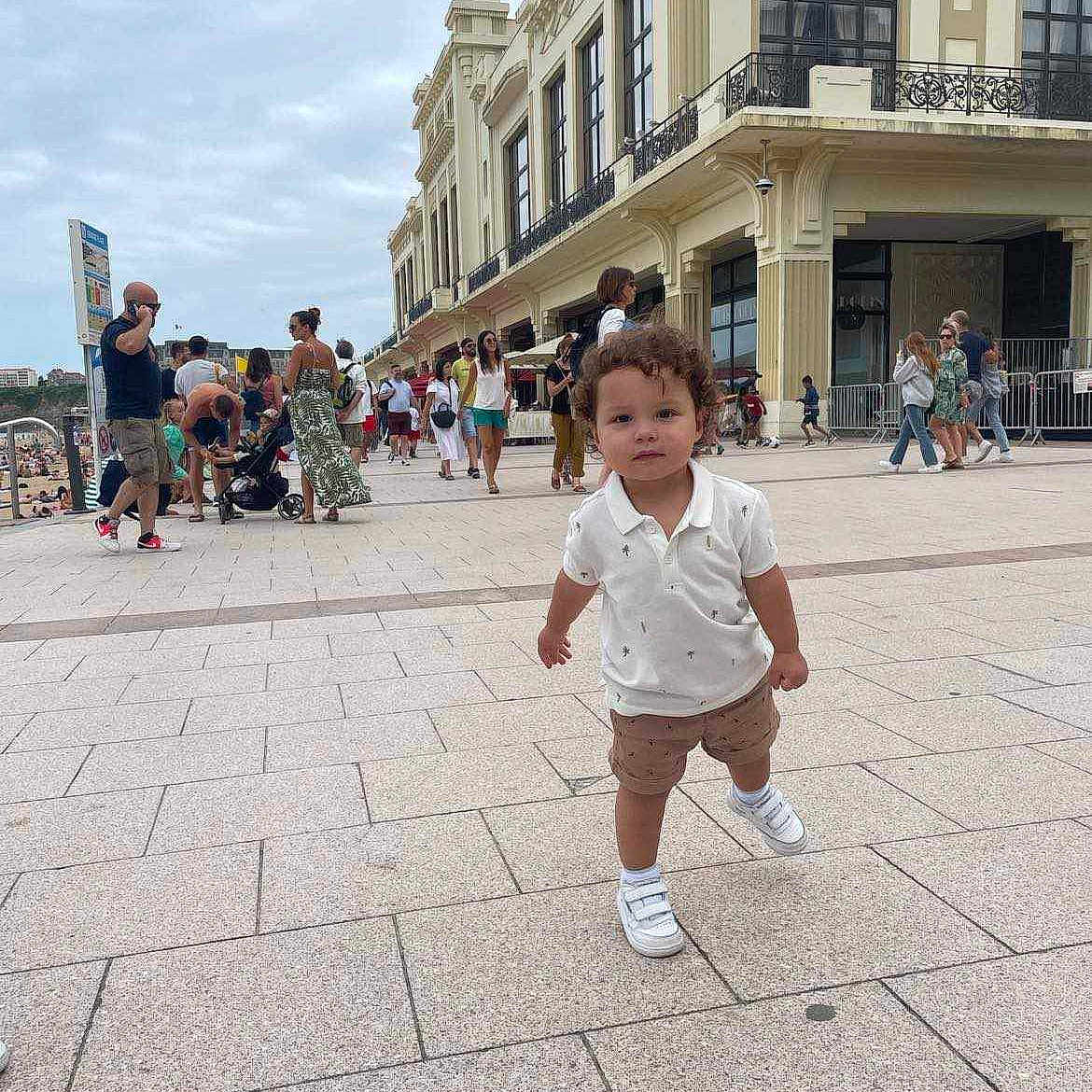 Charlie is registered to the contest to win money with this photo: advertisement, alley, amusementpark, architecture, baseballcap, blackhair, boardwalk, bodypart, boy, bridge, brownhair, building, cap, child, city, clothing, coat, condo, cream, dessert
