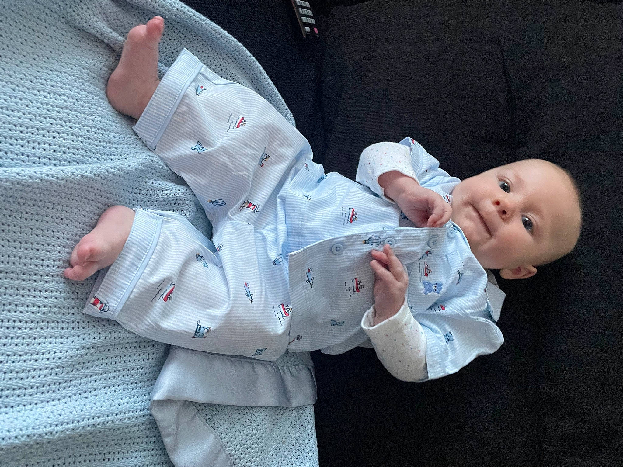 Alfie is registered to the contest to win money with this photo: baby, baby_products, baby_toddler_clothing, barefoot, child, comfort, elbow, finger, foot, gesture, human_leg, knee, lap, nail, pattern, person, sitting, sleeve, thumb, toddler