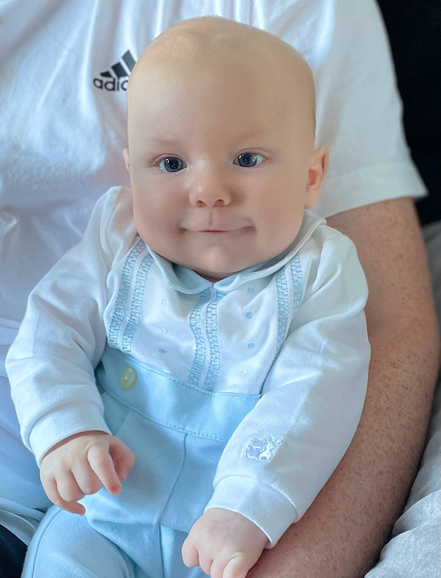 Alfie is registered to the contest to win money with this photo: baby, baby_toddler_clothing, cheek, child, collar, comfort, electric_blue, eye, gesture, happy, iris, lip, outerwear, person, product, sitting, skin, sleeve, smile, textile