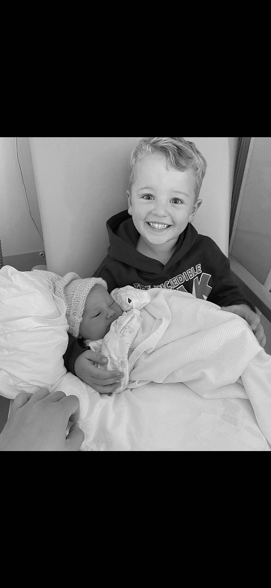 Oliver is registered to the contest to win money with this photo: arm, black_and_white, comfort, eye, face, finger, flash_photography, gesture, hairstyle, hand, happy, iris, joy, muscle, person, shoulder, skin, sleeve, smile, standing