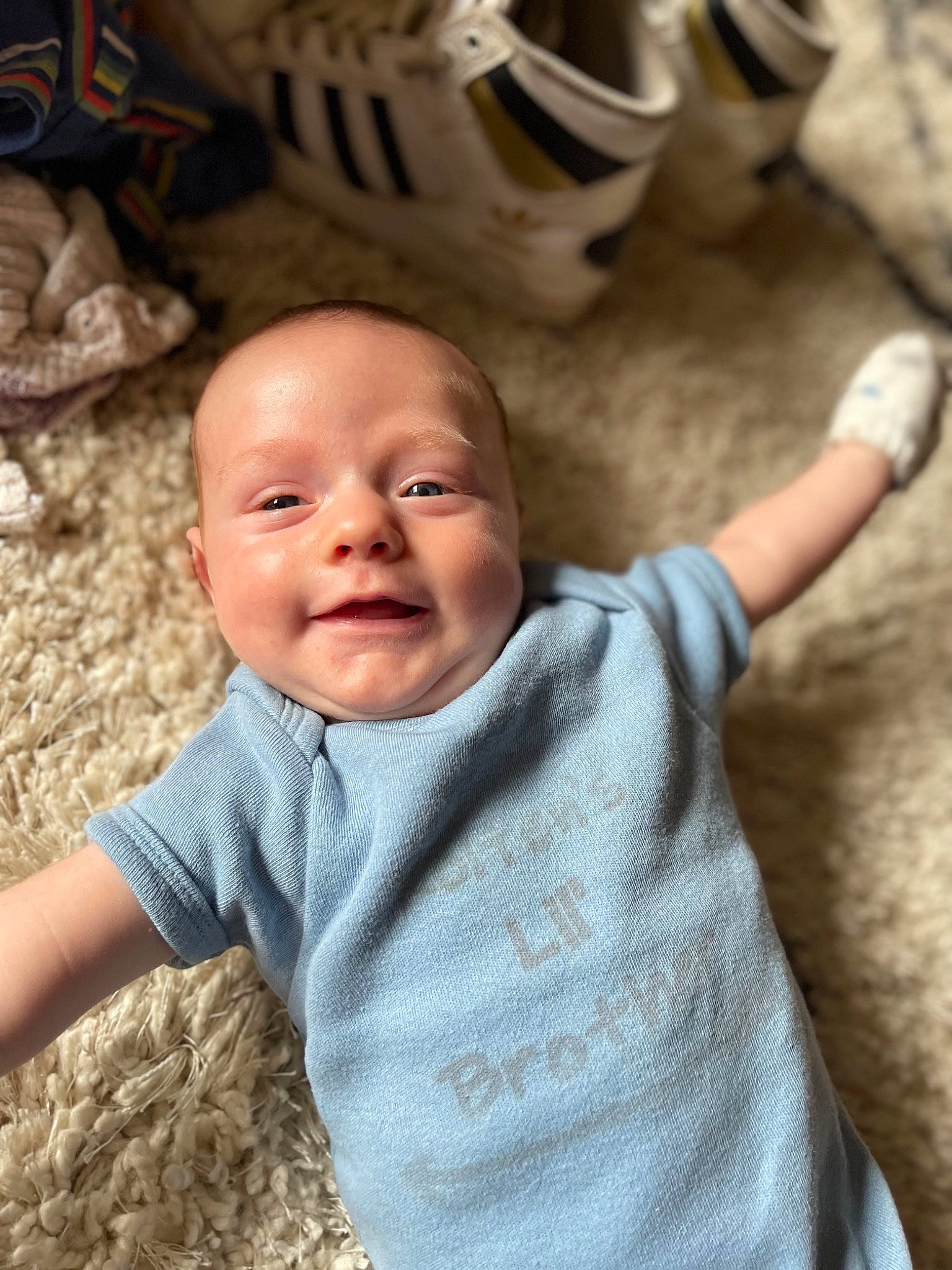 Ryker joined the competition — help win amazing prizes! baby, baby_toddler_clothing, child, chin, face, finger, fun, hand, happy, head, mammal, mouth, nose, person, sitting, skin, sleeve, smile, t_shirt, toddler