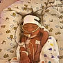 newborn, baby, hospital, incubator, medical_tubes, blanket, heart_pattern, lion_pattern, sensor_patches, head_bandage, sleeping, infant, premature_baby, medical_equipment, cozy, cute, child, resting, healthcare, monitored