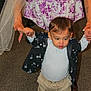 Jason joined the competition — help win amazing prizes! adult, baby, carpet, child, cute, family, floor, floral_dress, hands, holding, indoor, jacket, learning_to_walk, pants, person, socks, support, toddler, walking, young
