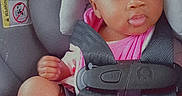 Serenity joined the competition — help win amazing prizes! baby, child, car_seat, seatbelt, pink_clothing, headband, bow, infant, cute, safety, child_seat, portrait, indoors, baby_girl, skin, face, legs, feet, expression, young_child