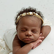 Tchani is registered to the contest to win money with this photo: baby, sleeping, headband, star, curly_hair, arm, blanket, soft_texture, peaceful, portrait, infant, resting, closeup, cute, child, face, skin, adorable, newborn, calm