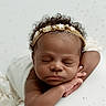 baby, sleeping, headband, star, curly_hair, arm, blanket, soft_texture, peaceful, portrait, infant, resting, closeup, cute, child, face, skin, adorable, newborn, calm
