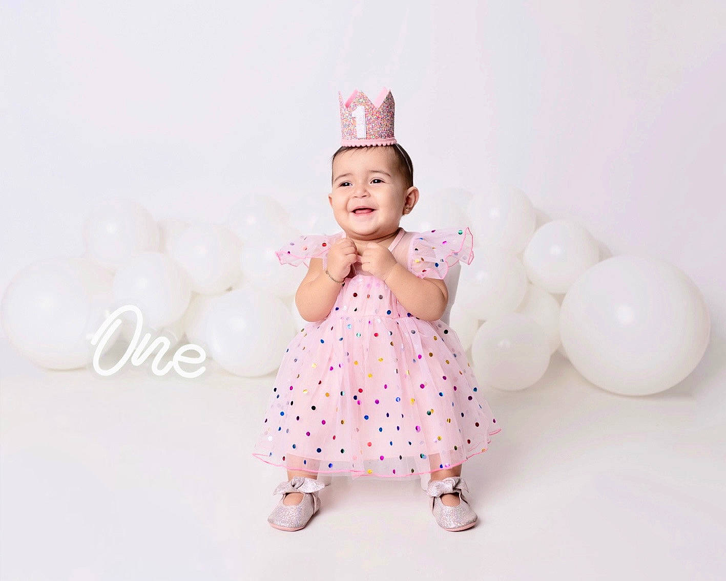 Katalyna is registered to the contest to win money with this photo: baby, baby_toddler_clothing, balloon, child, event, face, flash_photography, fun, gesture, happy, head, headpiece, joy, magenta, party_supply, person, pink, product, sitting, sleeve