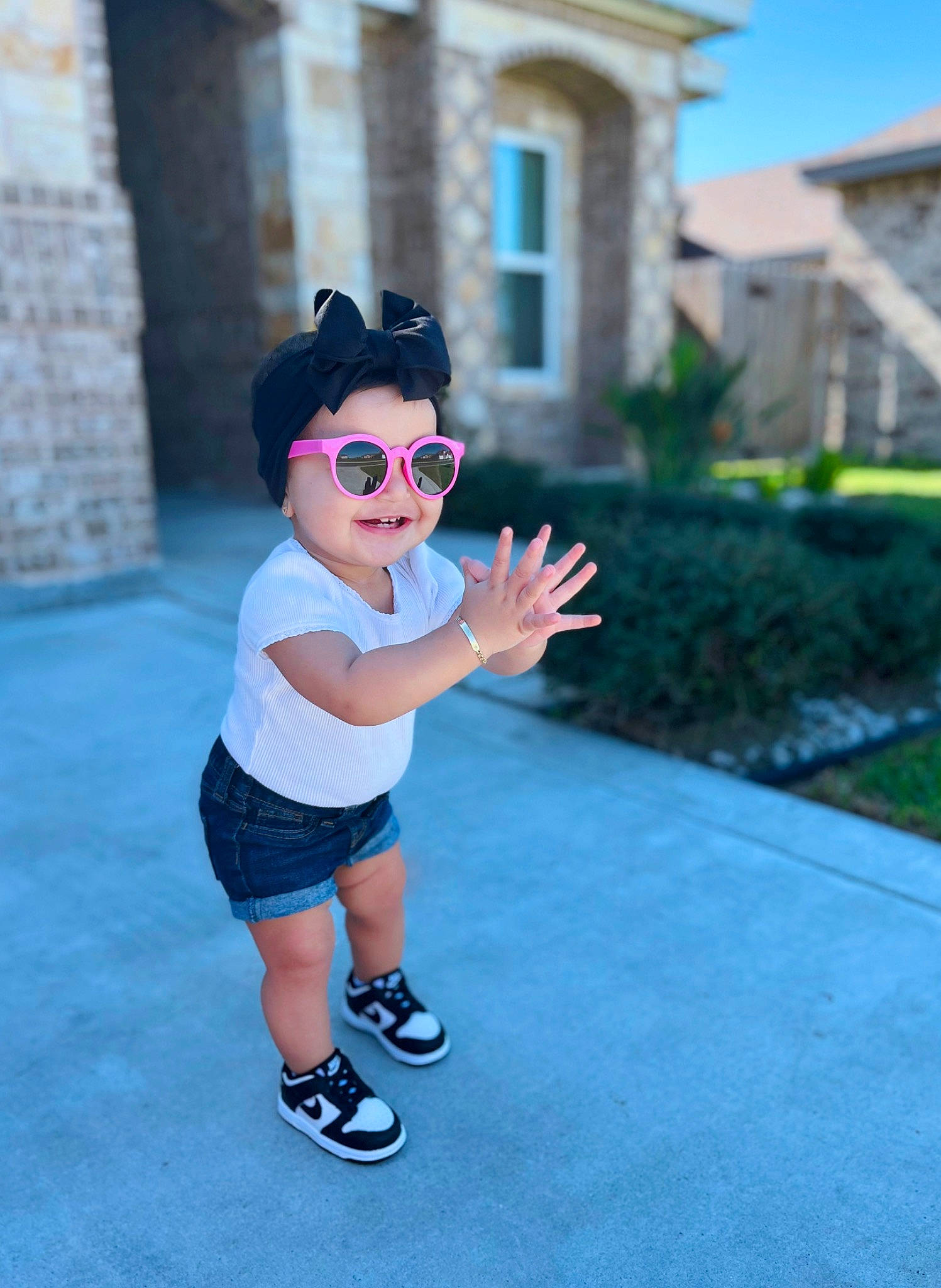 Katalyna is registered to the contest to win money with this photo: asphalt, cool, electric_blue, eyewear, fun, goggles, grass, happy, hat, human_leg, leisure, magenta, person, pink, plant, recreation, shorts, sunglasses, toddler, vision_care