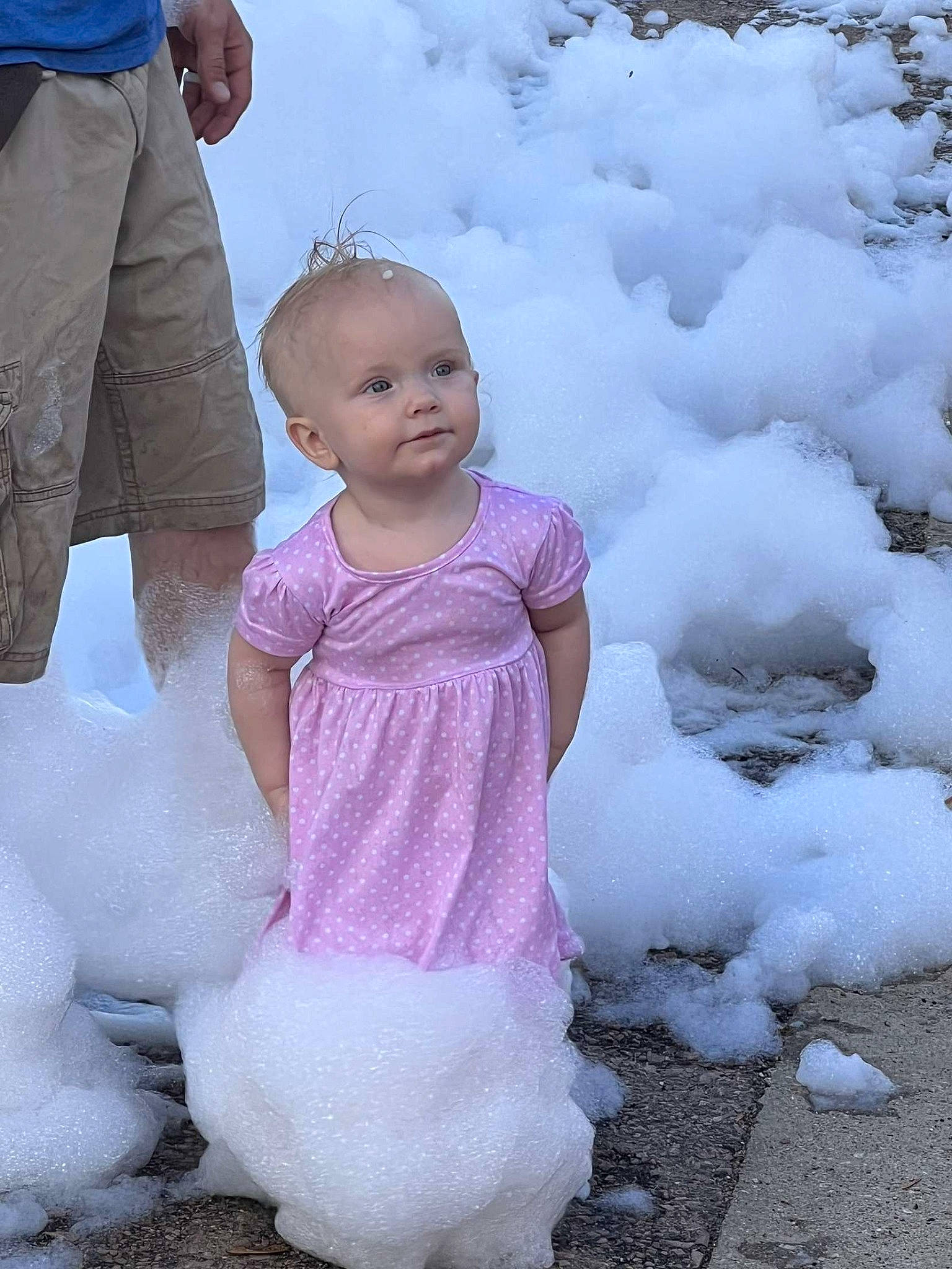 Wrenley is registered to the contest to win money with this photo: arm, baby, baby_toddler_clothing, child, face, freezing, fun, happy, head, human_body, people_in_nature, person, pink, shorts, sleeve, snow, standing, toddler, trunk, white