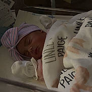 Linley is registered to the contest to win money with this photo: newborn, baby, sleeping, hospital, blanket, hat, infant, bassinet, cozy, cute, pink, striped, resting, peaceful, child, mittens, soft, indoor, portrait, young