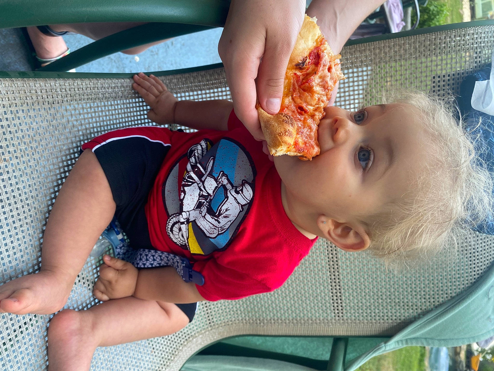 Amiris is registered to the contest to win money with this photo: baby, baby_products, baby_toddler_clothing, child, facial_expression, food, foot, fun, grass, human_leg, knee, leisure, mouth, person, play, recreation, skin, thigh, toddler, vacation