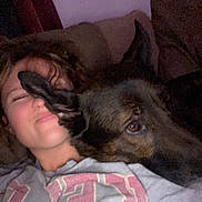 Baxter Roo joined the competition — help win amazing prizes! person, dog, pet, couch, indoors, portrait, selfie, cuddling, sleepy, relaxed, paw, face, brown_dog, large_dog, animal, home, furniture, sweatshirt, casual, low_light