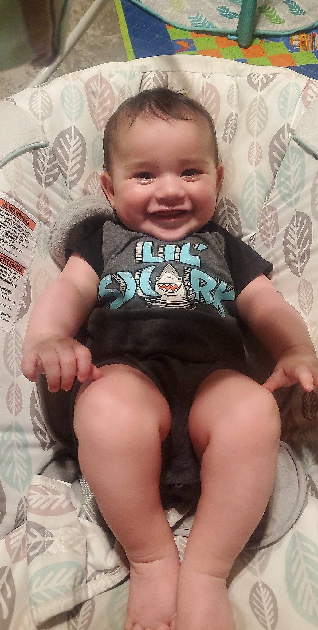 Levi is registered to the contest to win money with this photo: arm, baby_toddler_clothing, cheek, chin, comfort, eye, facial_expression, finger, hairstyle, hand, head, human_body, iris, joy, leg, mouth, neck, organ, person, skin