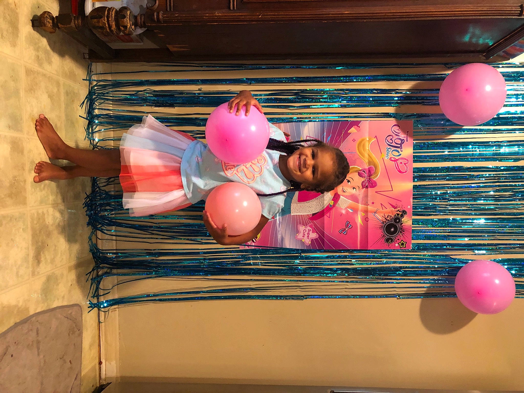 Tenaya is registered to the contest to win money with this photo: balloon, event, fun, happy, hat, helmet, joy, leisure, magenta, party_supply, peach, person, pink, recreation, room, window, wood