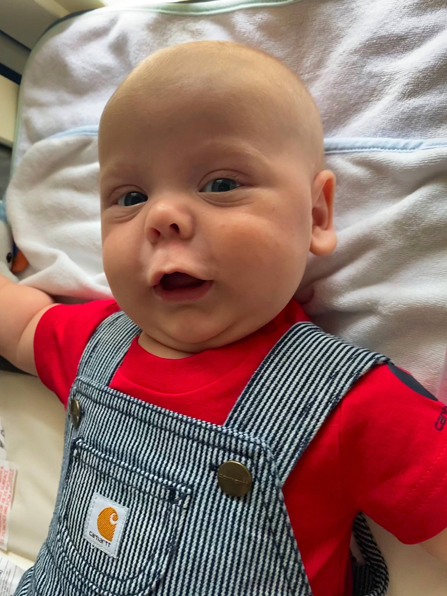 Opie is registered to the contest to win money with this photo: baby, baby_toddler_clothing, cheek, chin, collar, eye, eyebrow, face, facial_expression, hairstyle, happy, head, iris, lip, mouth, nose, person, skin, sleeve, smile