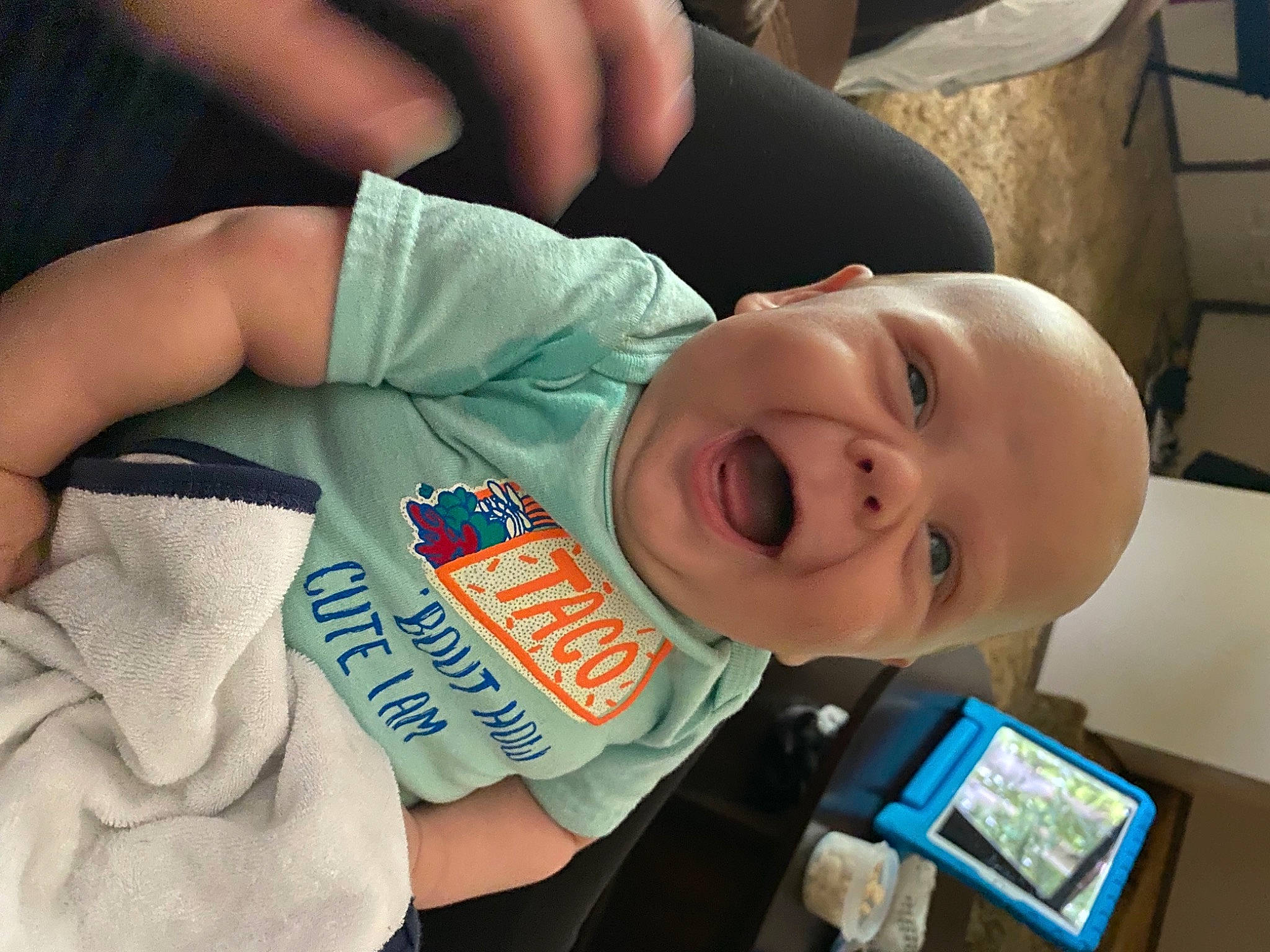 Opie joined the competition — help win amazing prizes! baby, baby_toddler_clothing, bottle, cheek, drinkware, ear, eye, face, facial_expression, finger, gesture, hand, head, mouth, nail, nose, person, plastic_bottle, product, skin