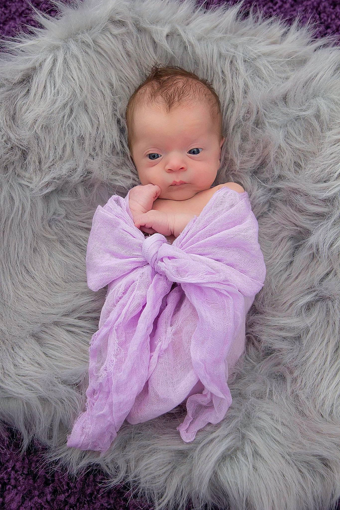 Gracen joined the competition — help win amazing prizes! baby, baby_toddler_clothing, cheek, comfort, face, fur, happy, head, iris, linens, magenta, mammal, outerwear, person, pink, purple, skin, sleeve, textile, toddler