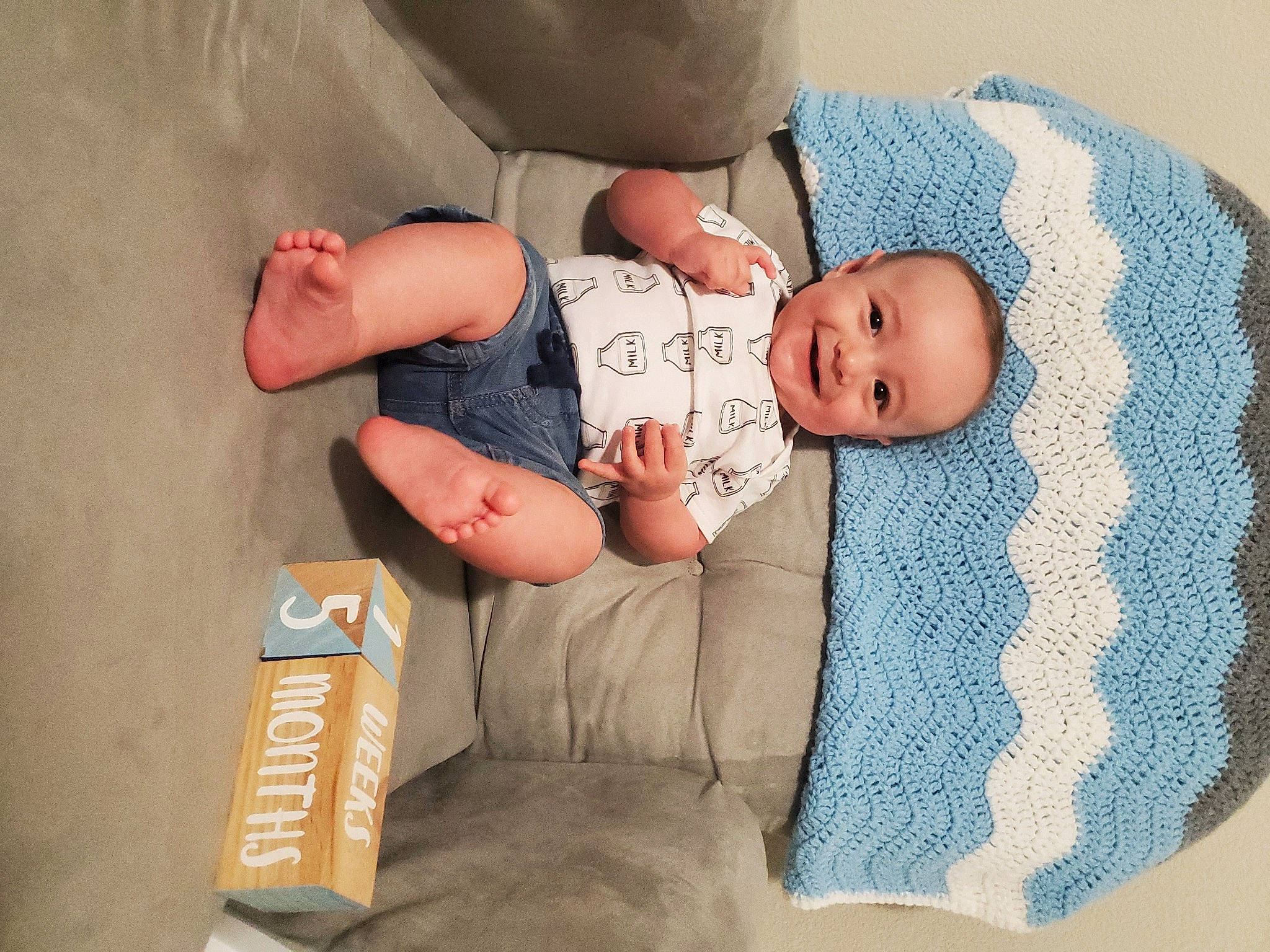 Josiah is registered to the contest to win money with this photo: arm, baby, baby_products, baby_sleeping, baby_toddler_clothing, child, comfort, foot, hand, hat, joy, linens, nap, person, room, shipping_box, sitting, skin, sleep, sleeve