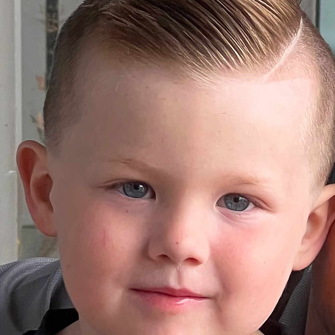 Brody is registered to the contest to win money with this photo: baby, blonde, crewcut, face, hair, head, mohawkhairstyle, person