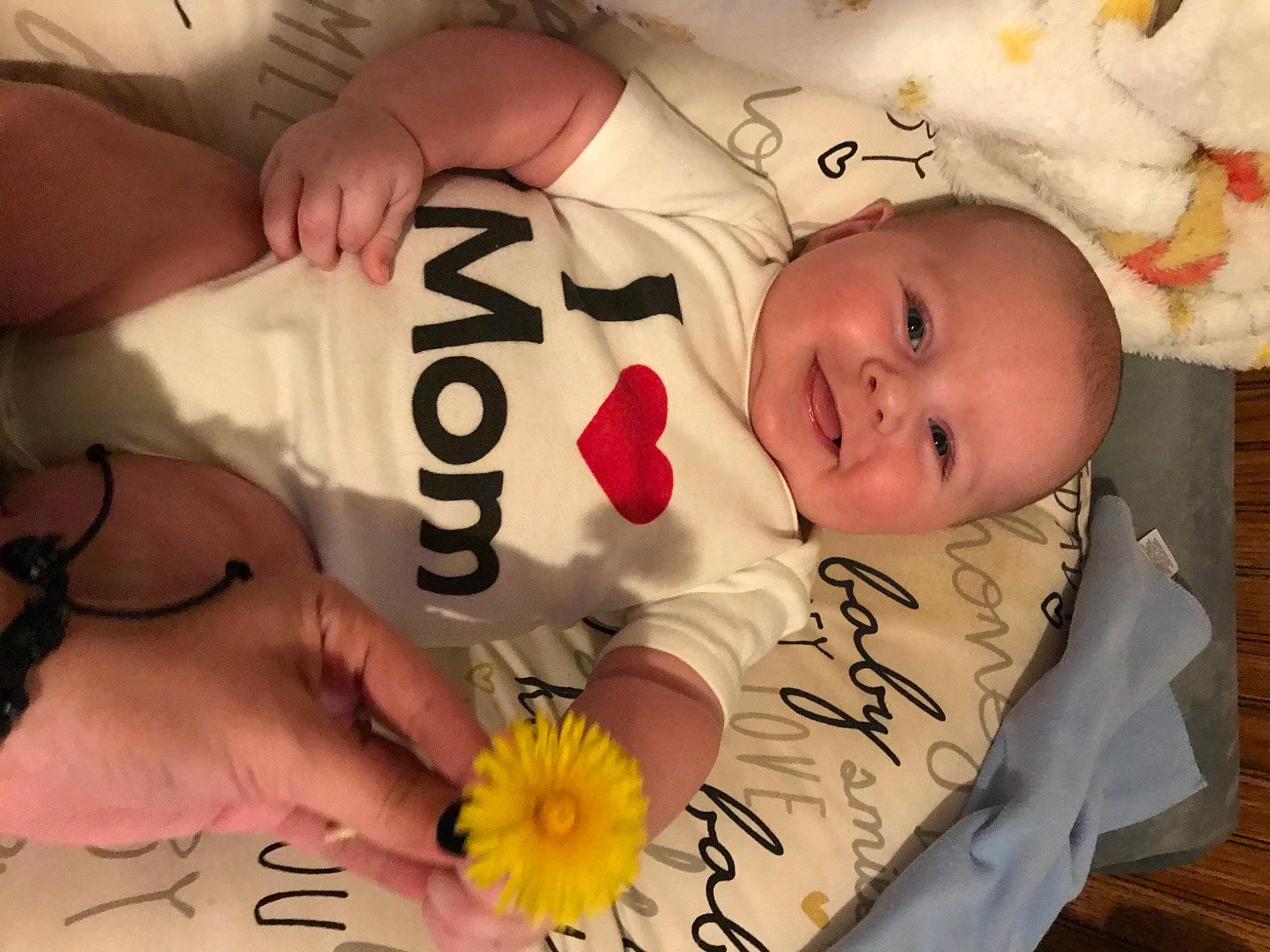 Cason joined the competition — help win amazing prizes! baby, baby_toddler_clothing, cheek, child, comfort, cut_flowers, facial_expression, finger, flower, flower_arranging, font, happy, joy, linens, organ, person, petal, plant, skin, smile