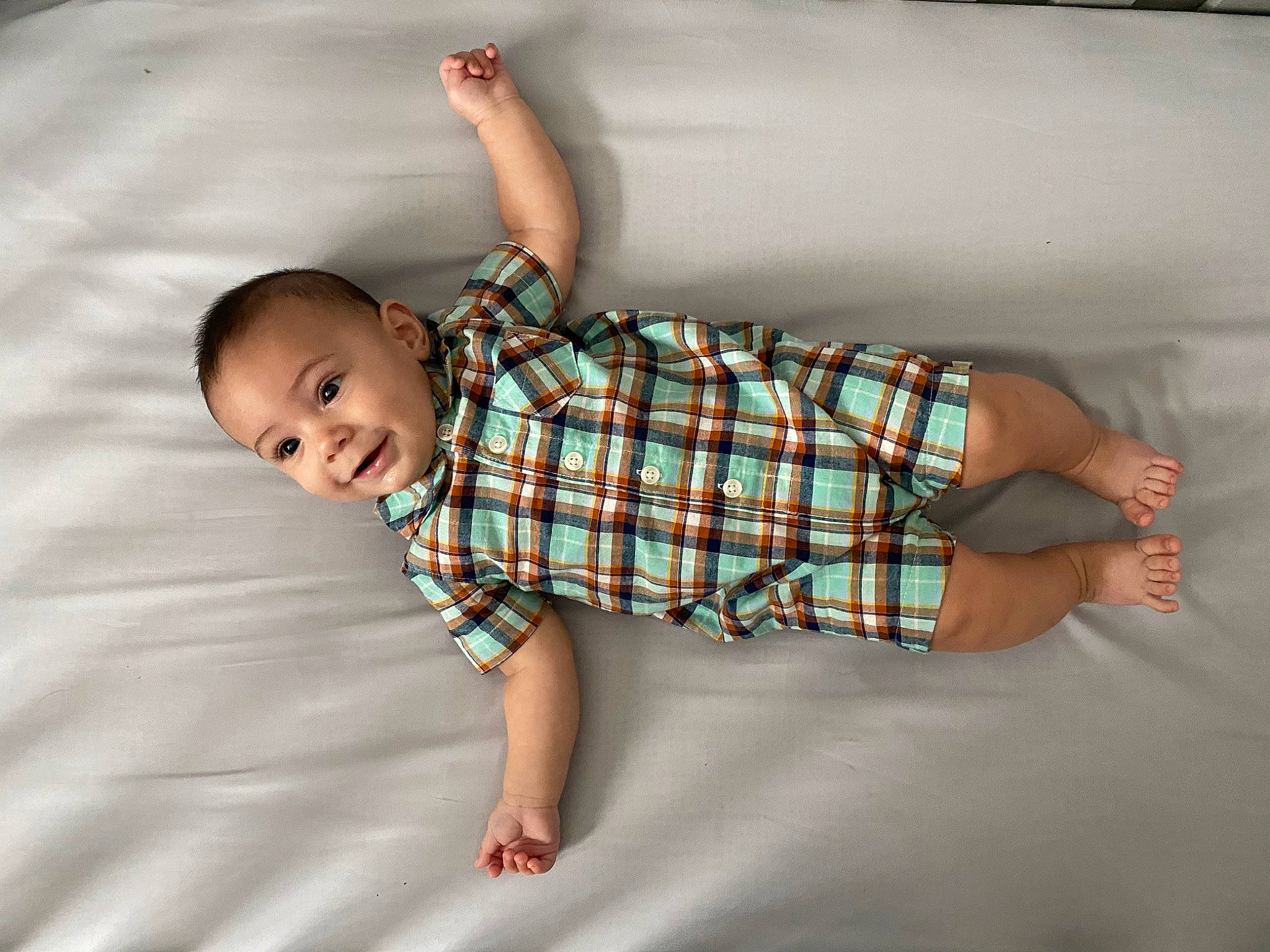 Zayden is registered to the contest to win money with this photo: abdomen, arm, baby, baby_toddler_clothing, child, design, leg, pattern, person, plaid, textile, toddler