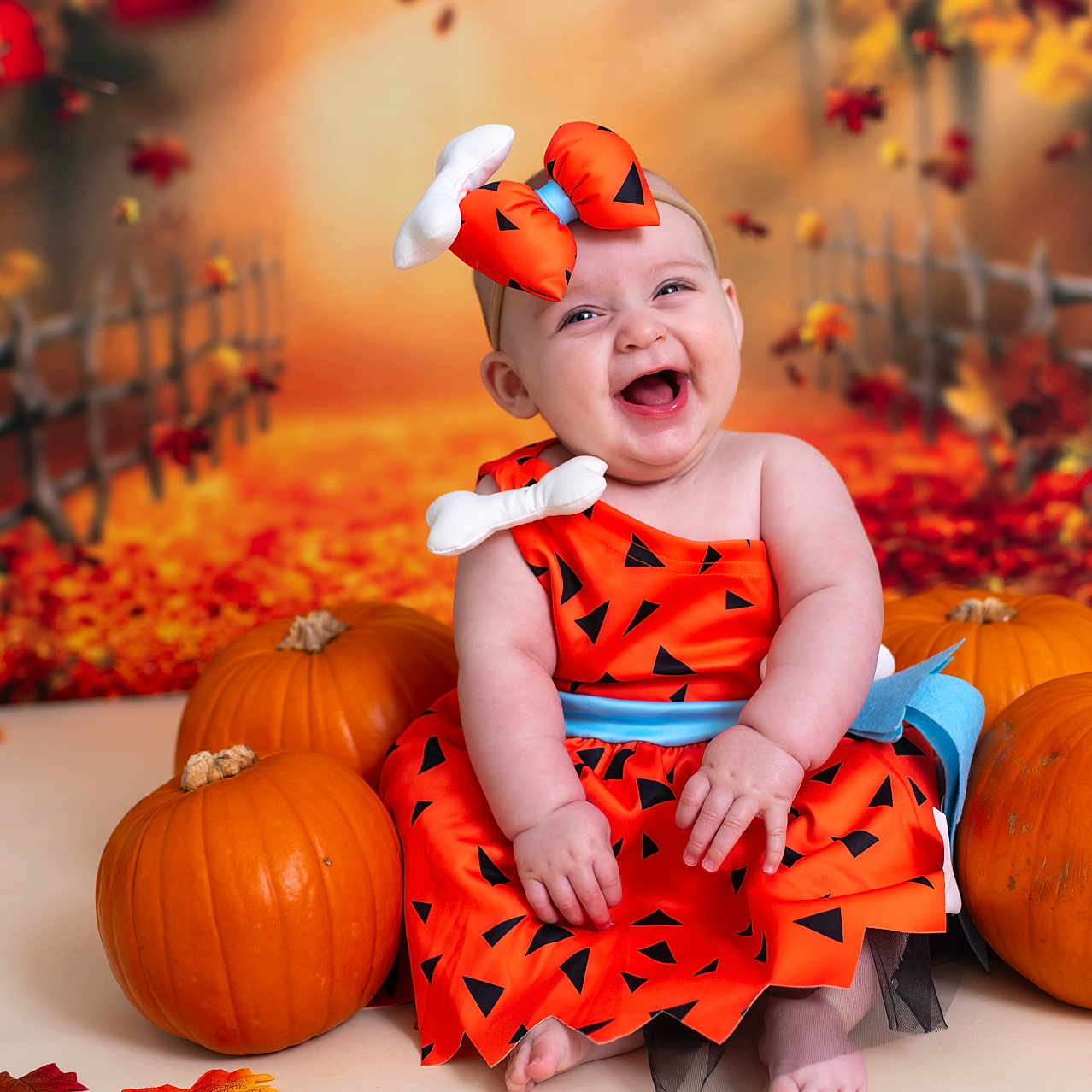 Hallie is registered to the contest to win money with this photo: baby, bodypart, clothing, dress, face, finger, food, hand, happy, head, laughing, leaf, person, photography, plant, portrait, produce, pumpkin, squash, vegetable