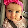 baby, child, pink_bow, headband, car_seat, seatbelt, blue_eyes, pink_dress, face, portrait, infant, cute, young_child, clothing, sitting, indoor, closeup, person, expression, baby_girl