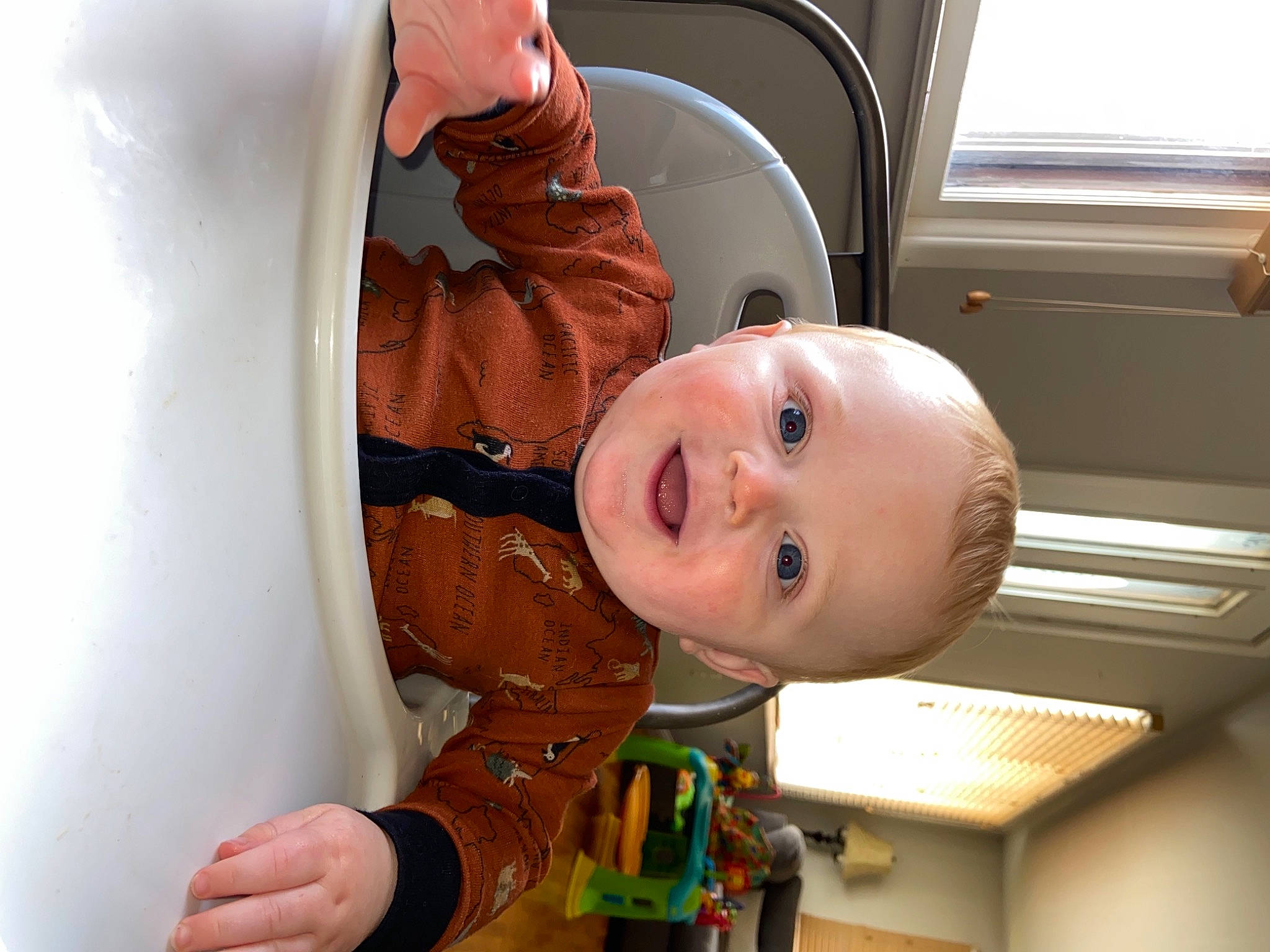 Korbin is registered to the contest to win money with this photo: baby, baby_products, baby_toddler_clothing, chair, cheek, child, comfort, finger, food, jacket, mouth, nose, organ, person, sleeve, smile, t_shirt, toddler, vehicle_door, window