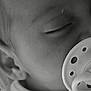 Azzurra participe au concours pour gagner de l'argent avec cette photo : baby, close_up, pacifier, sleeping, face, infant, monochrome, black_and_white, child, peaceful, cute, soft_focus, ear, mouth, skin, portrait, newborn, resting, calm, young