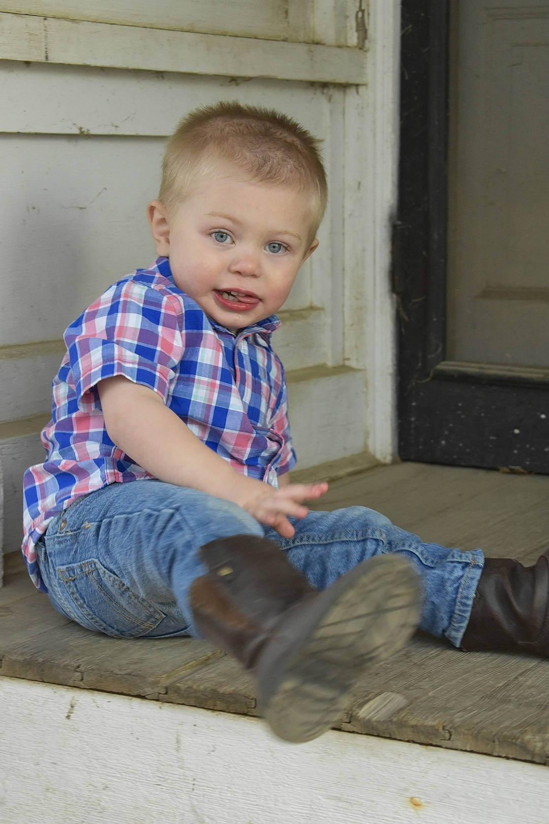 Micah joined the competition — help win amazing prizes! baby, cheek, child, denim, floor, flooring, jeans, leg, person, sitting, smile, standing, toddler, vacation, wood