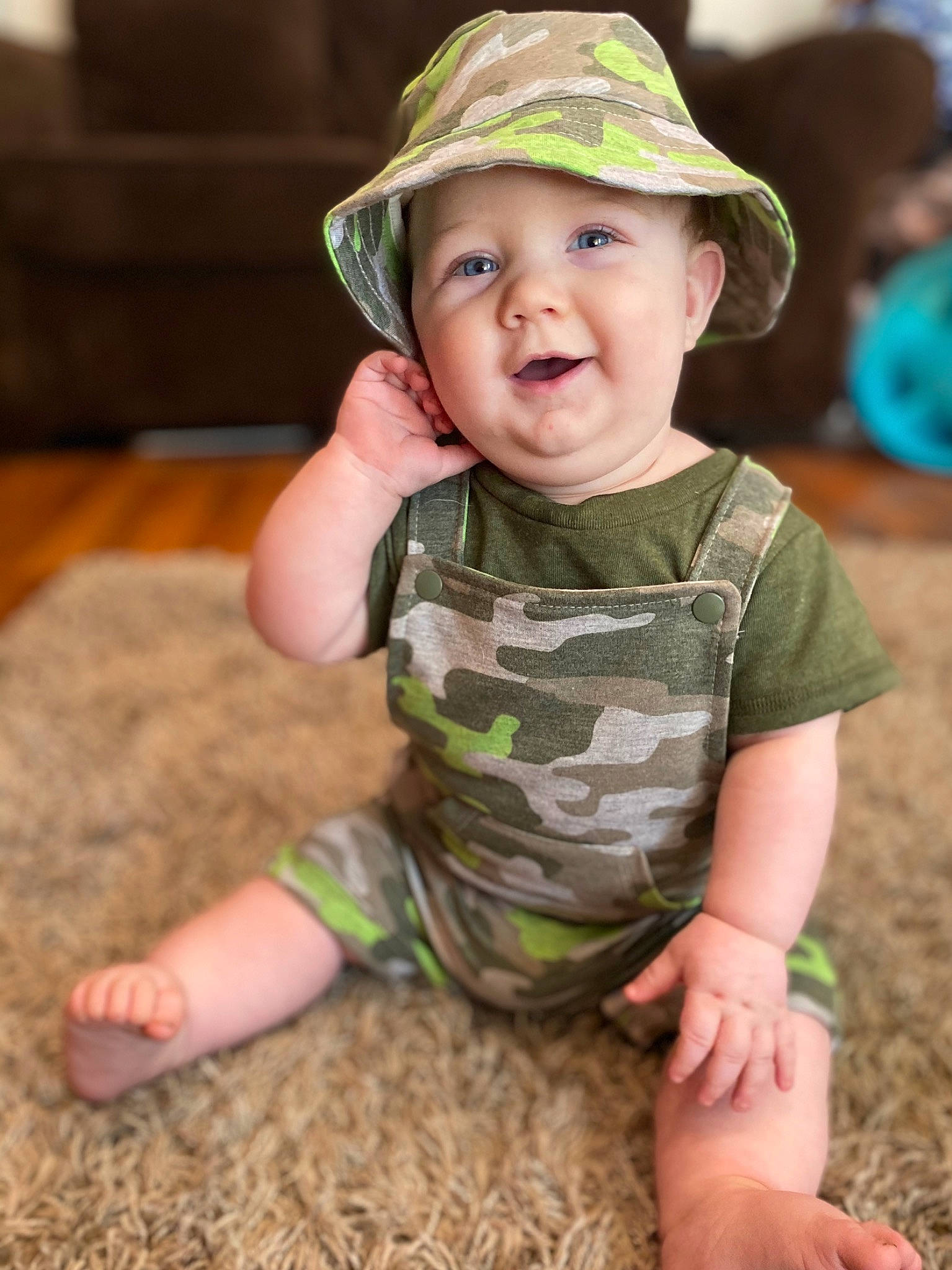 Asher is registered to the contest to win money with this photo: baby, baby_toddler_clothing, camouflage, cap, child, child_model, hat, headgear, headwear, pattern, people, person, personal_protective_equipment, play, skin, smile, sun_hat, toddler, vacation