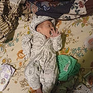 Kingston joined the competition — help win amazing prizes! baby, infant, pacifier, onesie, blanket, bedspread, floral_pattern, sleeping, clothing, foot, hand, baby_clothes, fabric, pattern, soft, cute, indoor, resting, child, newborn