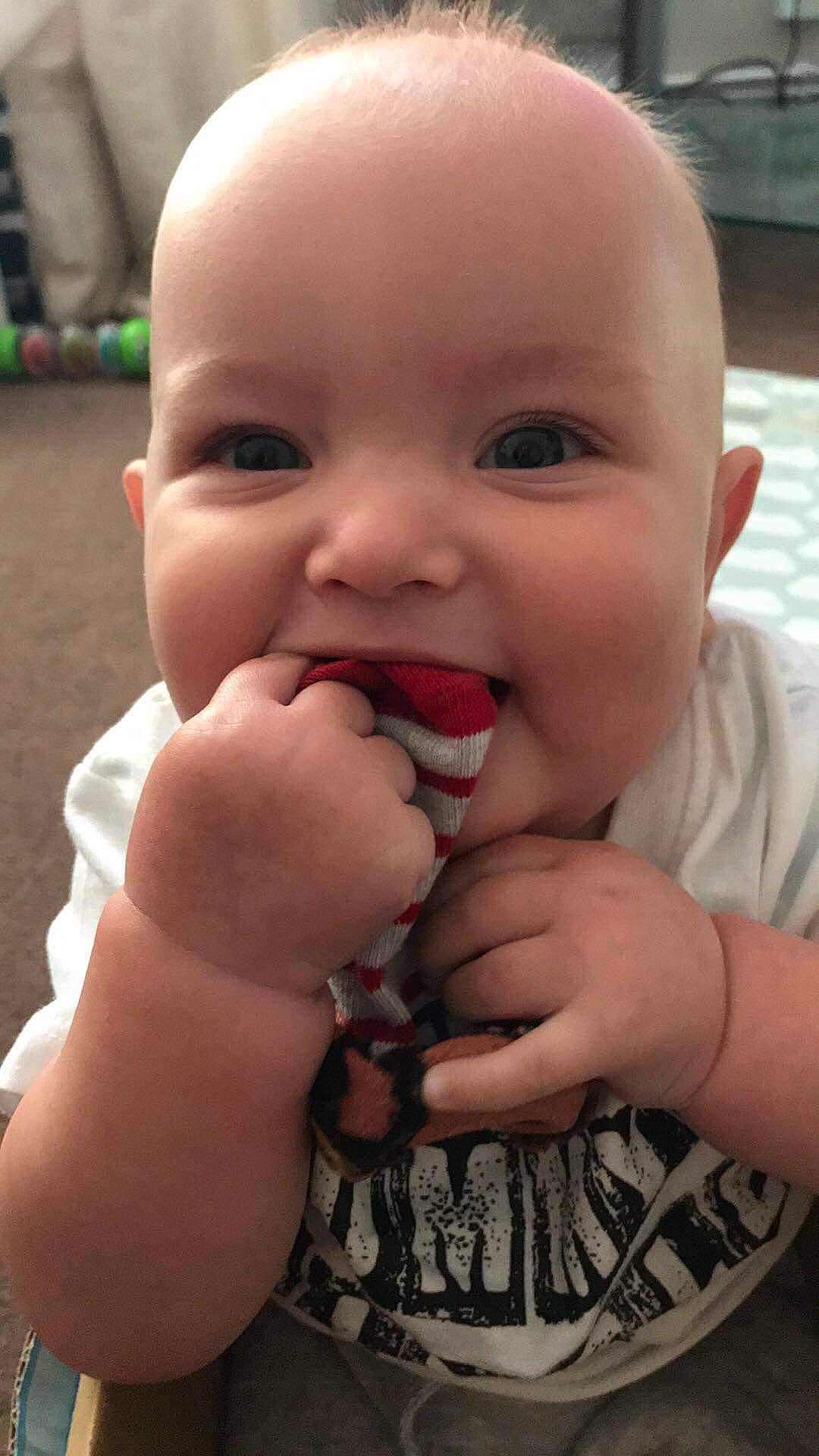 Loki is registered to the contest to win money with this photo: baby, cheek, child, chin, face, facial_expression, finger, gesture, hand, head, jaw, lip, mouth, nail, nose, person, skin, smile, thumb, toddler