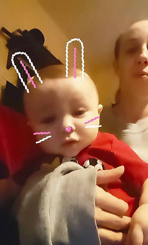 Kaleb is registered to the contest to win money with this photo: baby, cheek, child, ear, eyelash, face, finger, hair_accessory, hand, head, lip, mouth, nail, person, pink, skin, toddler, toy