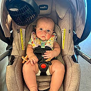 Aylah Mae is registered to the contest to win money with this photo: baby, car_seat, infant, child, seatbelt, fan, indoor, clothing, foot, hand, face, safety, cute, expression, comfort, patterned, looking, light, floor, strap